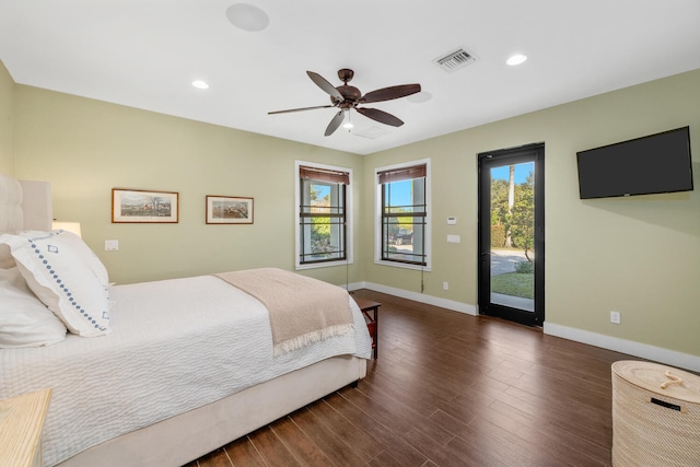 bedroom with dark wood-type flooring, ceiling fan, and access to exterior