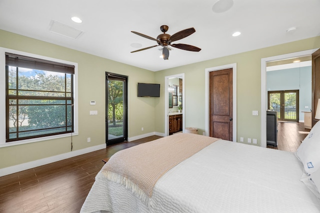 bedroom featuring ceiling fan, dark hardwood / wood-style flooring, ensuite bath, and access to outside