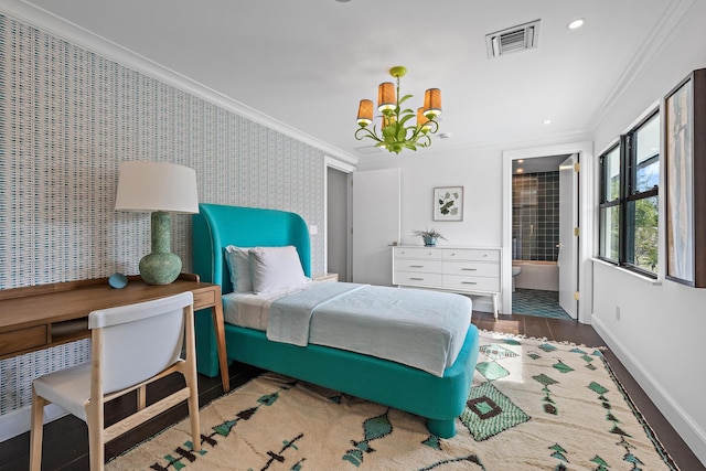 bedroom featuring hardwood / wood-style flooring, crown molding, and a chandelier