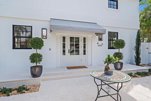 doorway to property featuring a patio area