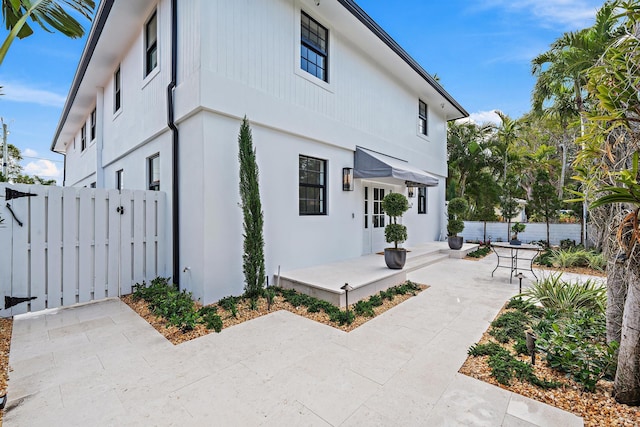 view of property exterior featuring a patio