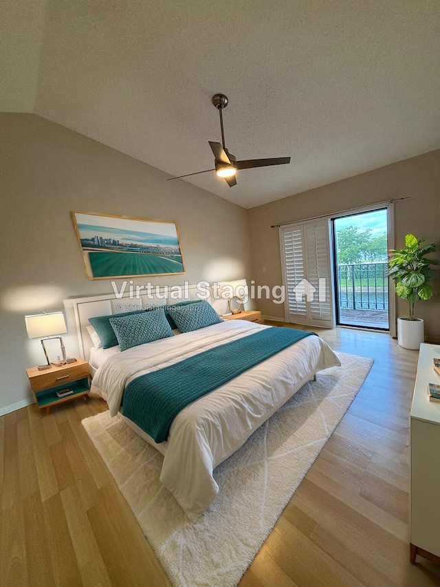 bedroom featuring vaulted ceiling, ceiling fan, light hardwood / wood-style flooring, and access to outside