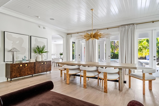 dining space featuring crown molding, wood ceiling, and light hardwood / wood-style flooring