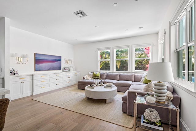 living room with light hardwood / wood-style floors