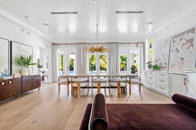 dining room with wooden ceiling, french doors, and light wood-type flooring