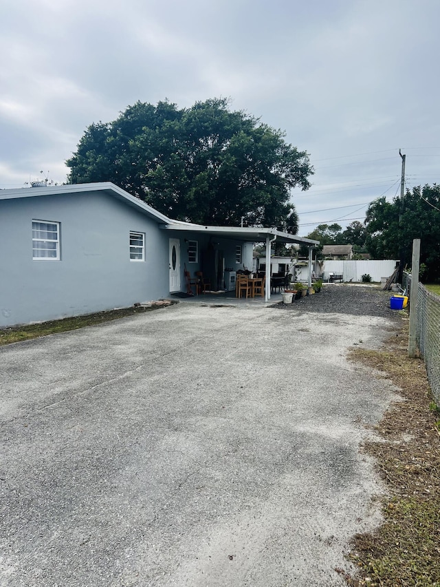 exterior space featuring a carport