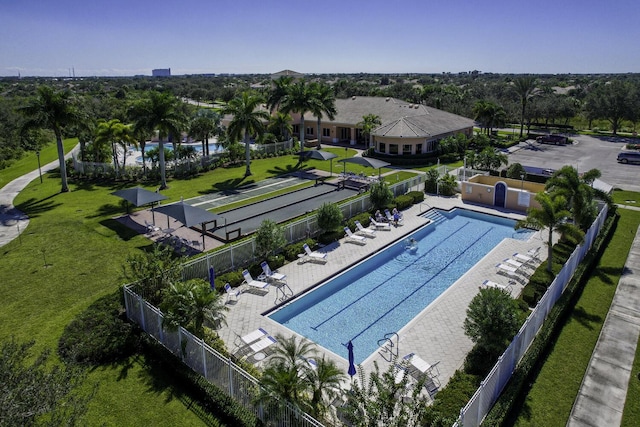 pool with fence and a patio