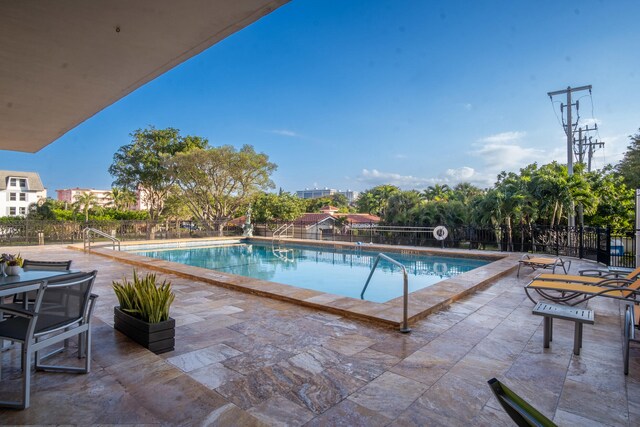 view of swimming pool with a patio