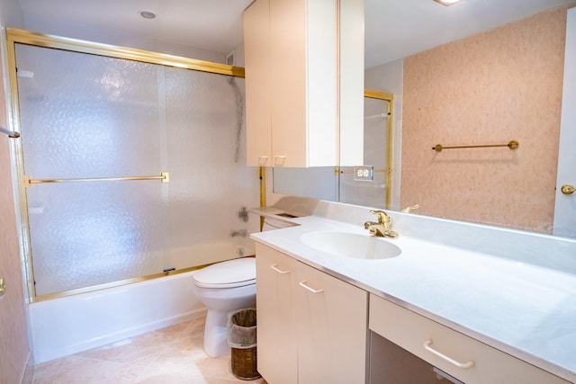 full bathroom with vanity, tile patterned flooring, enclosed tub / shower combo, and toilet