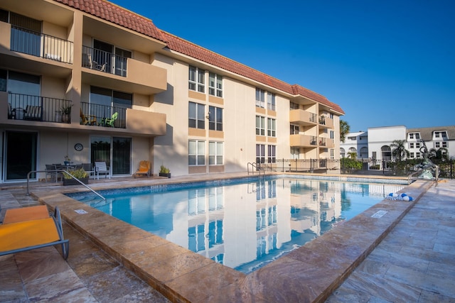 view of swimming pool featuring a patio