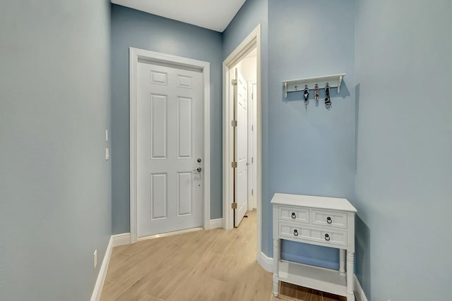 doorway to outside with light wood-type flooring