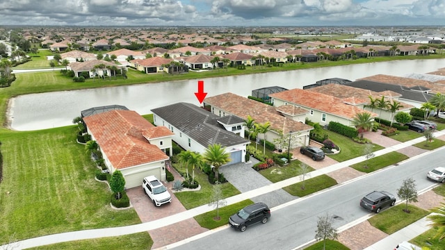 birds eye view of property featuring a water view