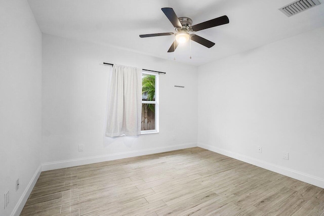 spare room featuring ceiling fan and light wood-type flooring