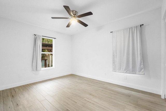 empty room featuring light hardwood / wood-style floors and ceiling fan