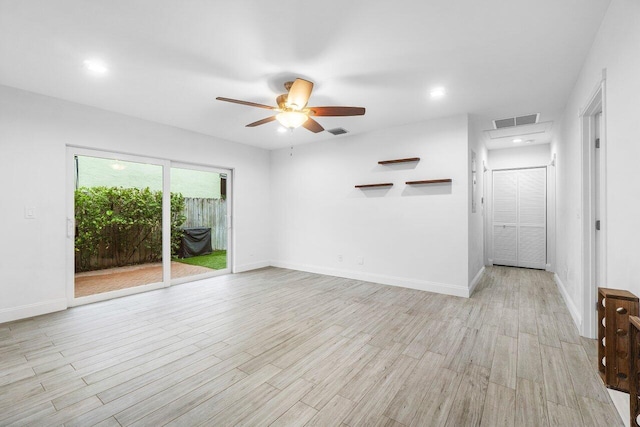 unfurnished living room featuring light wood-type flooring and ceiling fan