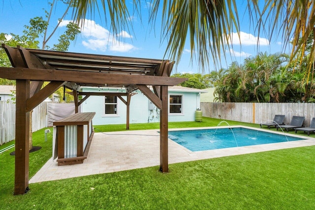 view of swimming pool with pool water feature and a yard