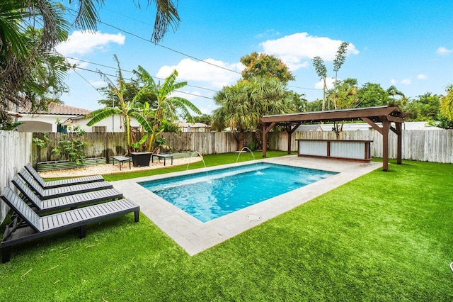 view of pool featuring a yard and a patio