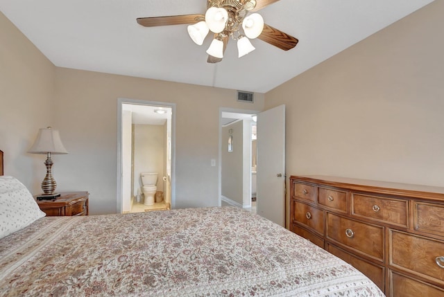 bedroom with ceiling fan and ensuite bath