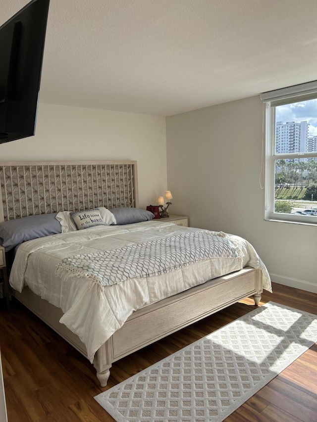 bedroom featuring dark hardwood / wood-style floors