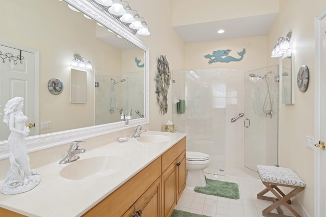 bathroom featuring toilet, tile patterned flooring, a shower with door, and vanity