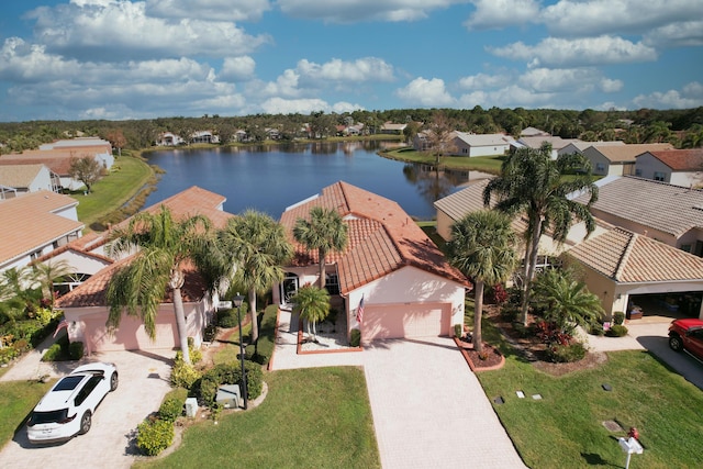 birds eye view of property with a water view