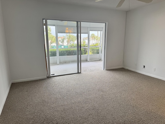 empty room featuring ceiling fan and carpet flooring