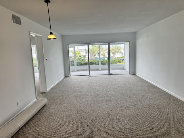 unfurnished room with carpet flooring