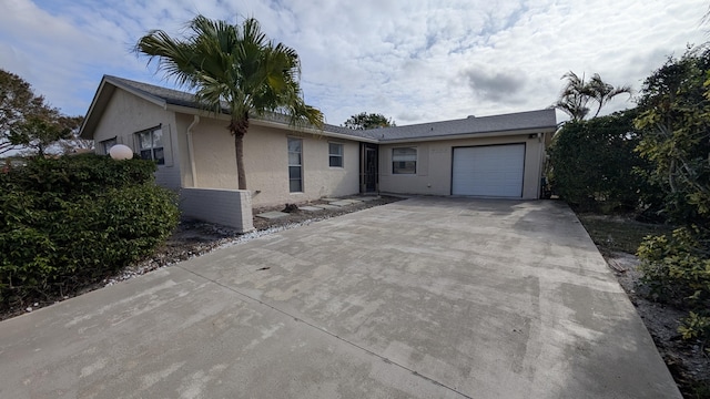 ranch-style home with a garage