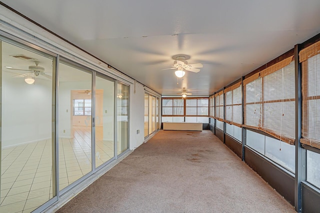 interior space featuring ceiling fan