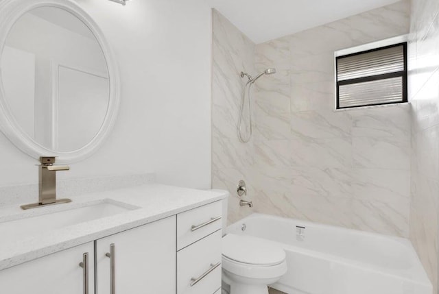 full bathroom featuring vanity, toilet, and tiled shower / bath