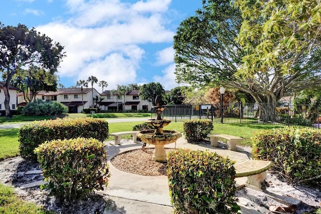 view of home's community with a yard