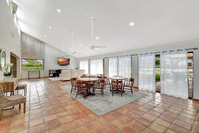 dining area featuring ceiling fan and high vaulted ceiling