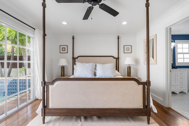 bedroom featuring ceiling fan, access to exterior, crown molding, hardwood / wood-style flooring, and connected bathroom