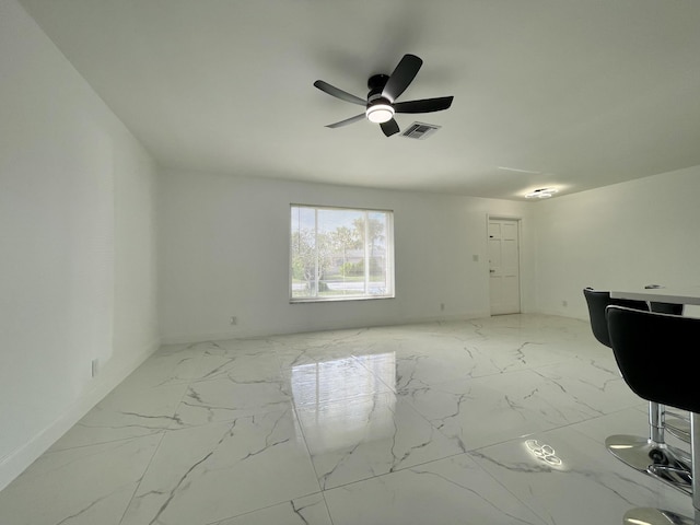 unfurnished living room featuring ceiling fan