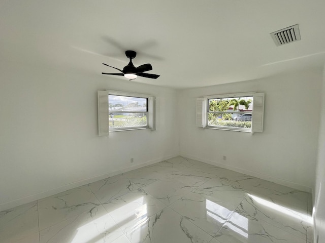 empty room featuring ceiling fan