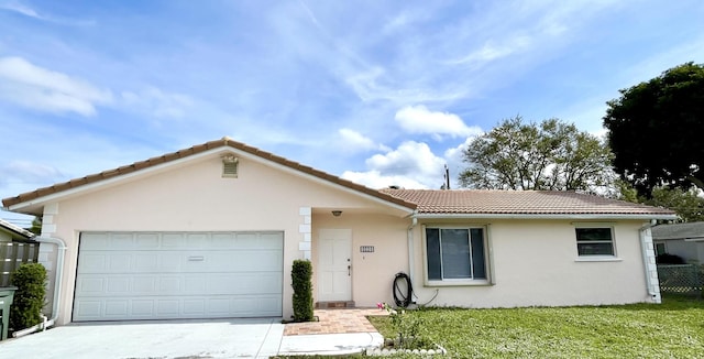 ranch-style house with a front lawn and a garage