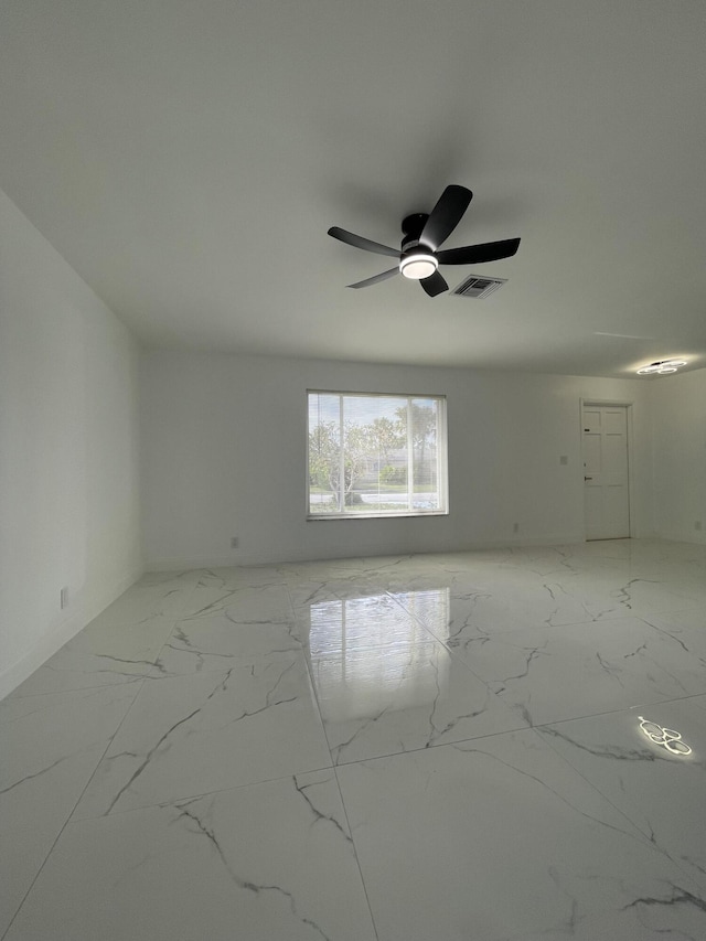 spare room with ceiling fan