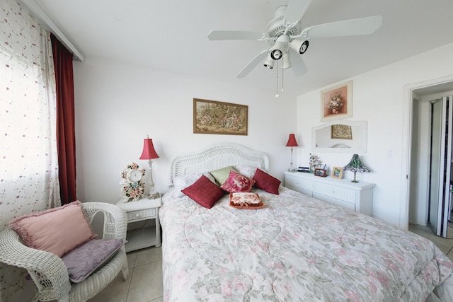 tiled bedroom with ceiling fan