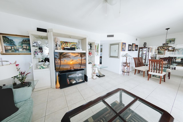 tiled living room with ceiling fan