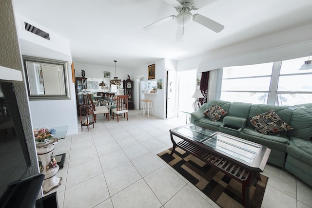 living room featuring ceiling fan and light tile patterned floors