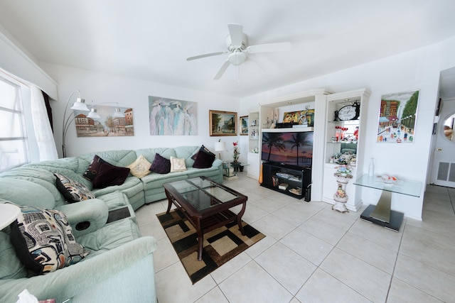 tiled living room featuring ceiling fan