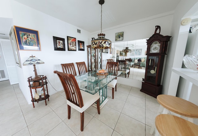 dining space featuring light tile patterned floors