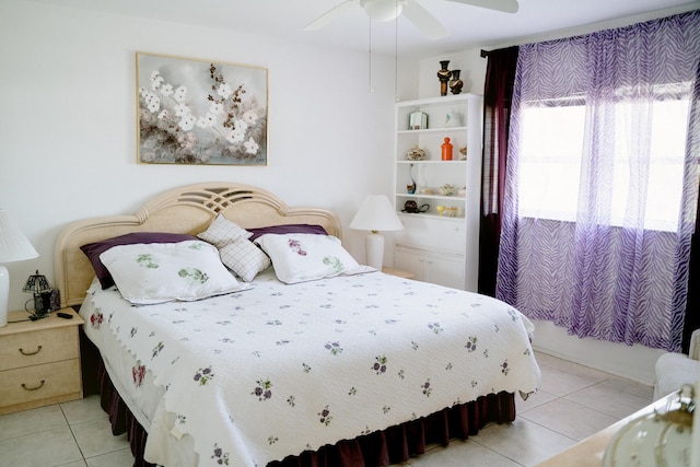 tiled bedroom with ceiling fan