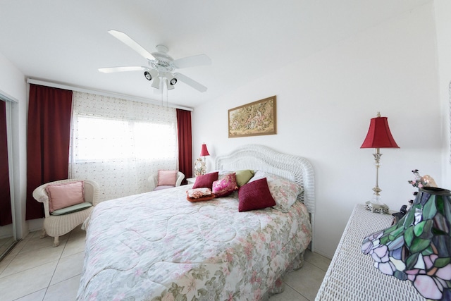 tiled bedroom with ceiling fan