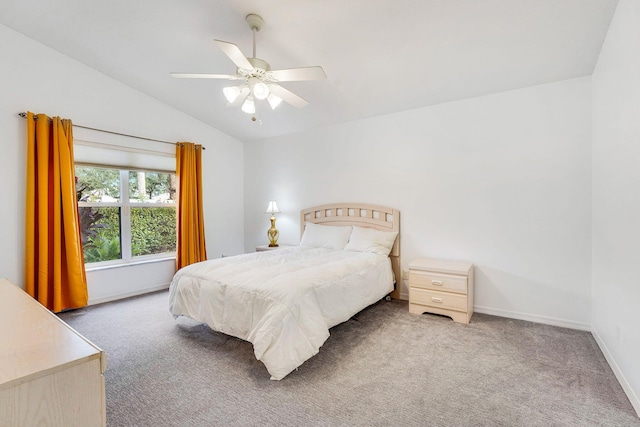 carpeted bedroom featuring ceiling fan and lofted ceiling