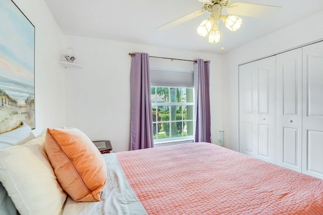 bedroom featuring ceiling fan and a closet