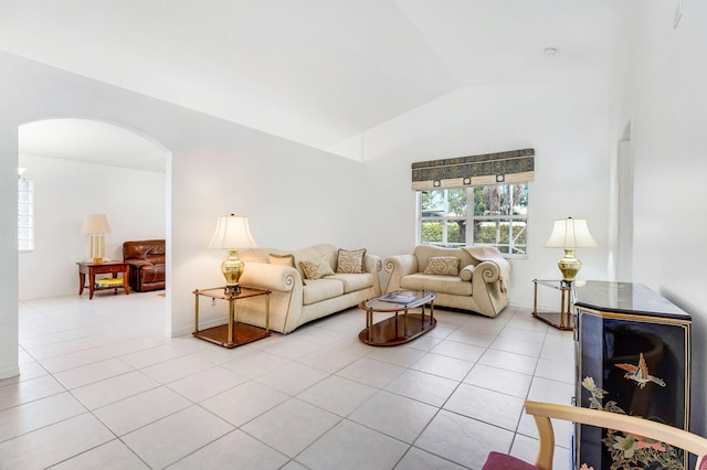 tiled living room featuring lofted ceiling