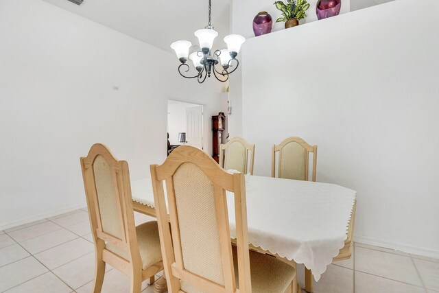 tiled living room with ceiling fan and lofted ceiling