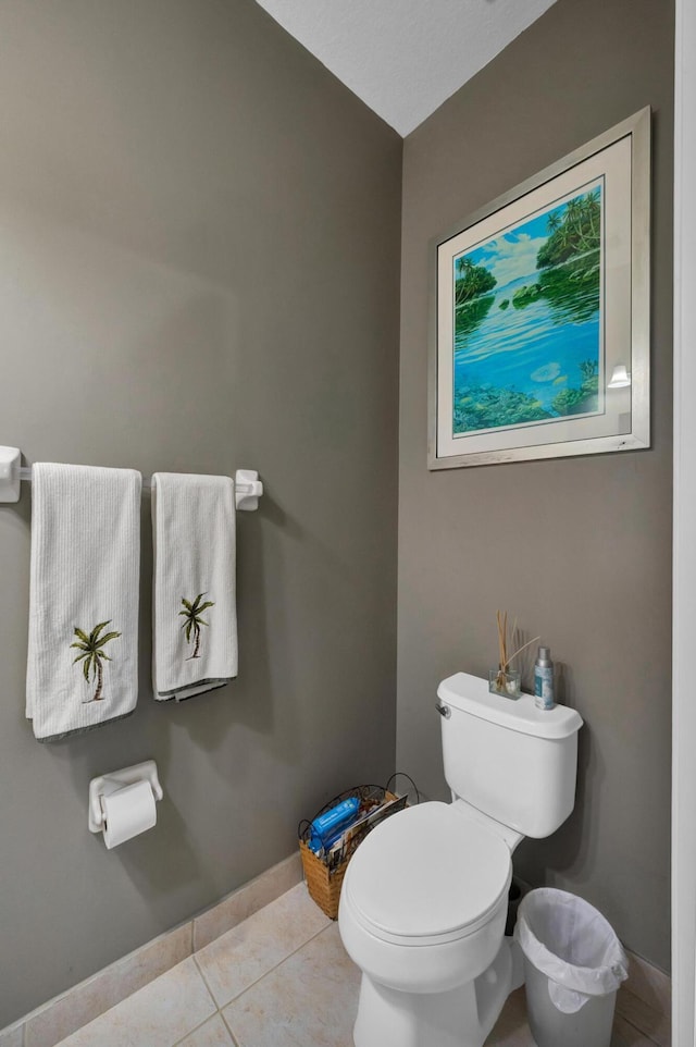 bathroom with toilet and tile patterned flooring