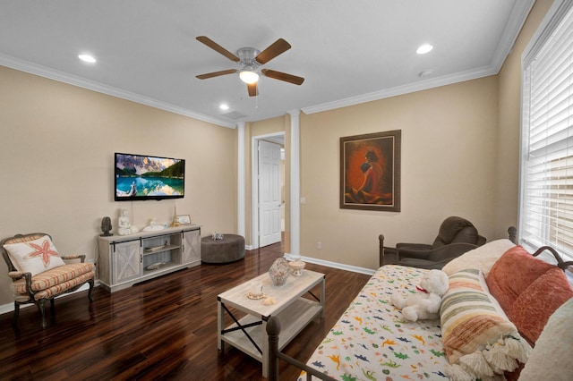 living room featuring ceiling fan, dark hardwood / wood-style flooring, crown molding, and decorative columns